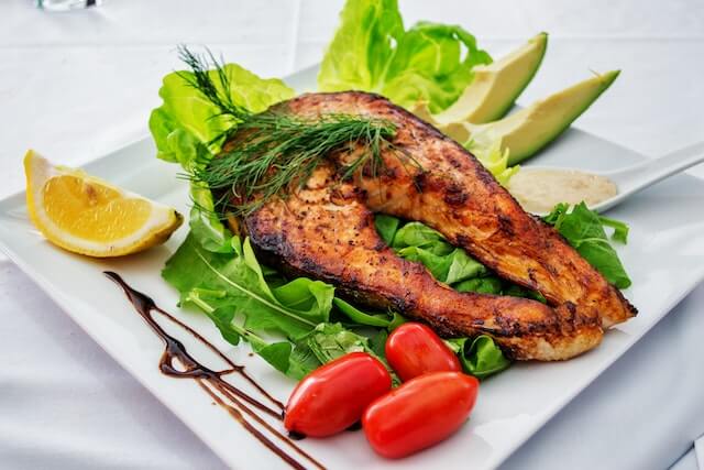 Healthy Cooked sea fish with salad