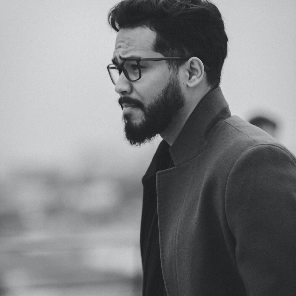 A gentleman wearing specs