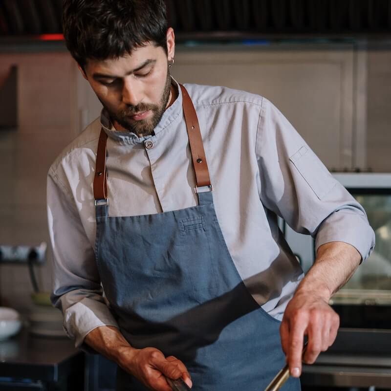 A Young man is cooking